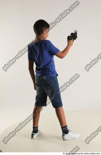 TIMBO STANDING POSE WITH GUN